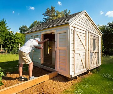 man building a shed